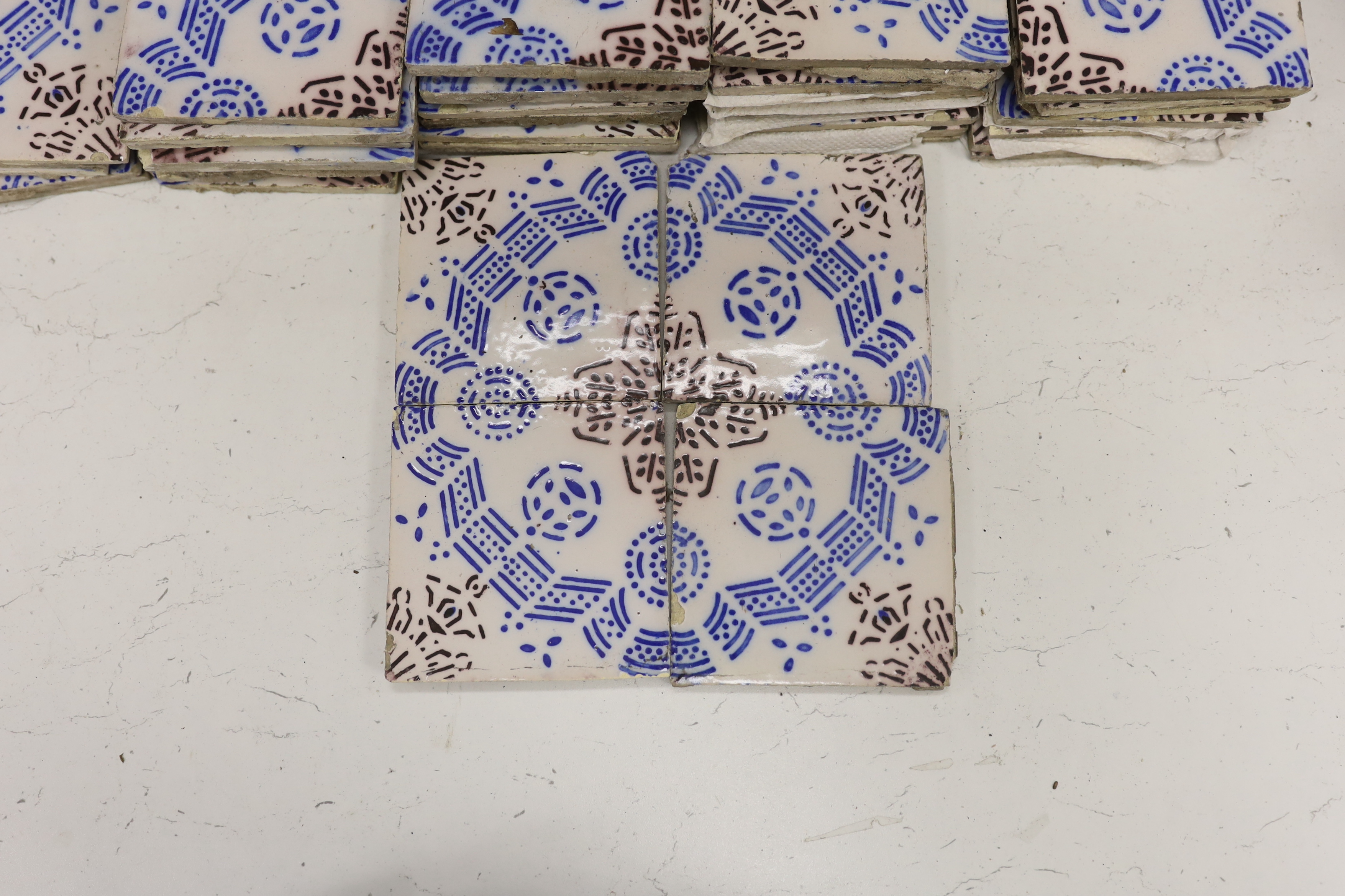 A large collection of French vintage tiles, stamped to reverse